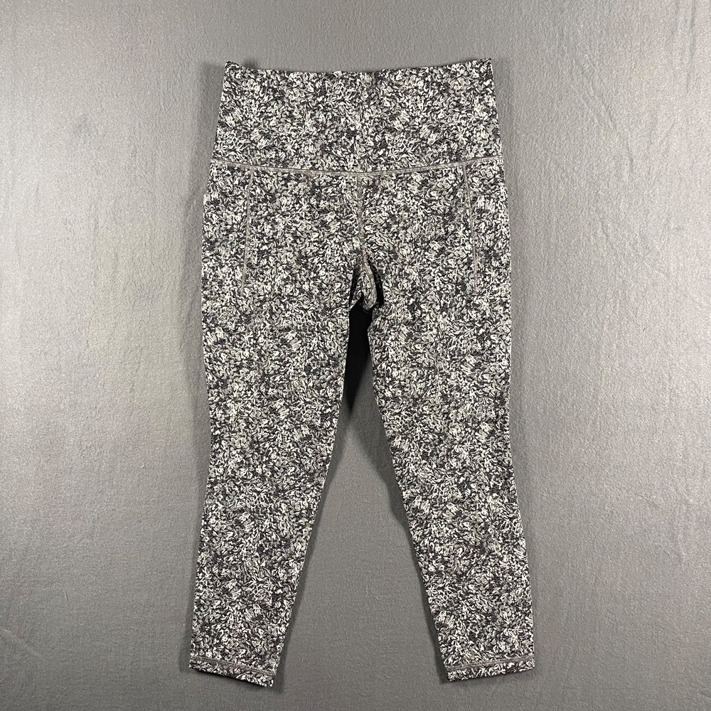 Athleta Salutation Stash Pocket II 7/8 Leggings S Black White Moonflower Print